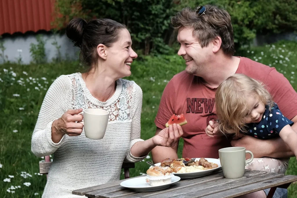 family having coffee and snacks